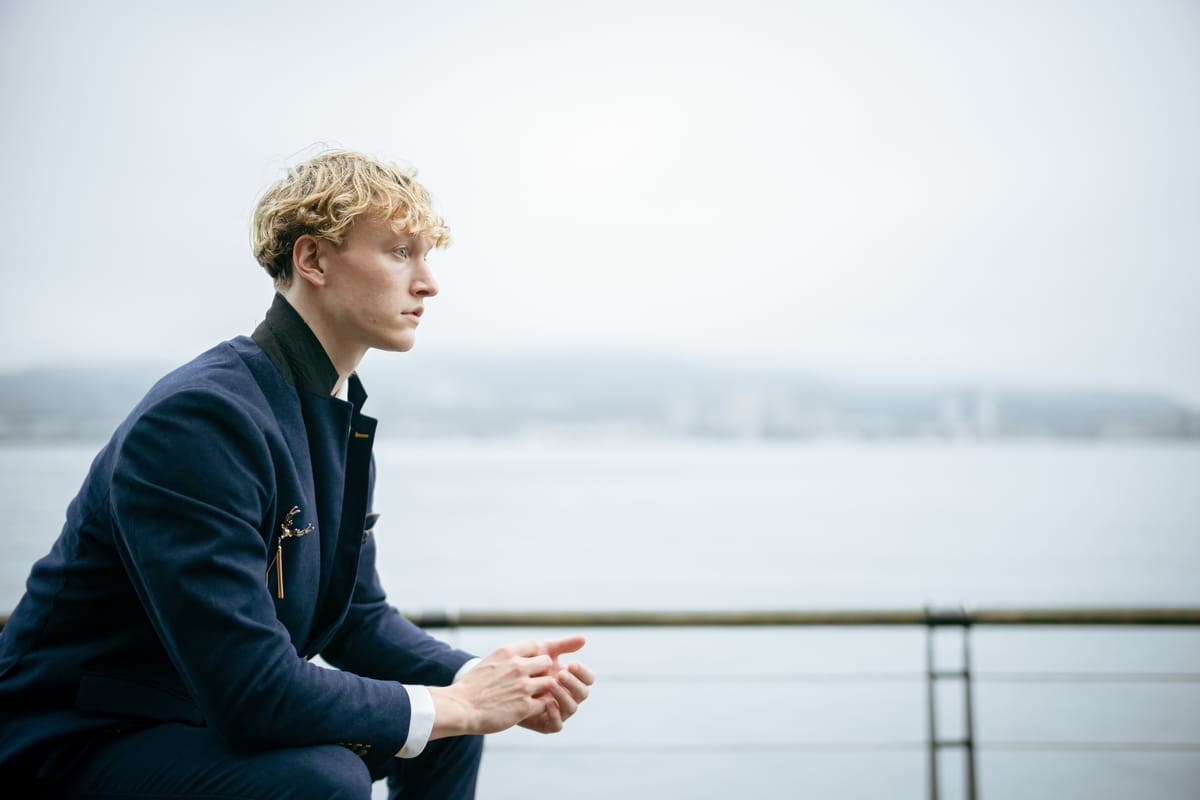 Grey Waterfront, Blue Suit